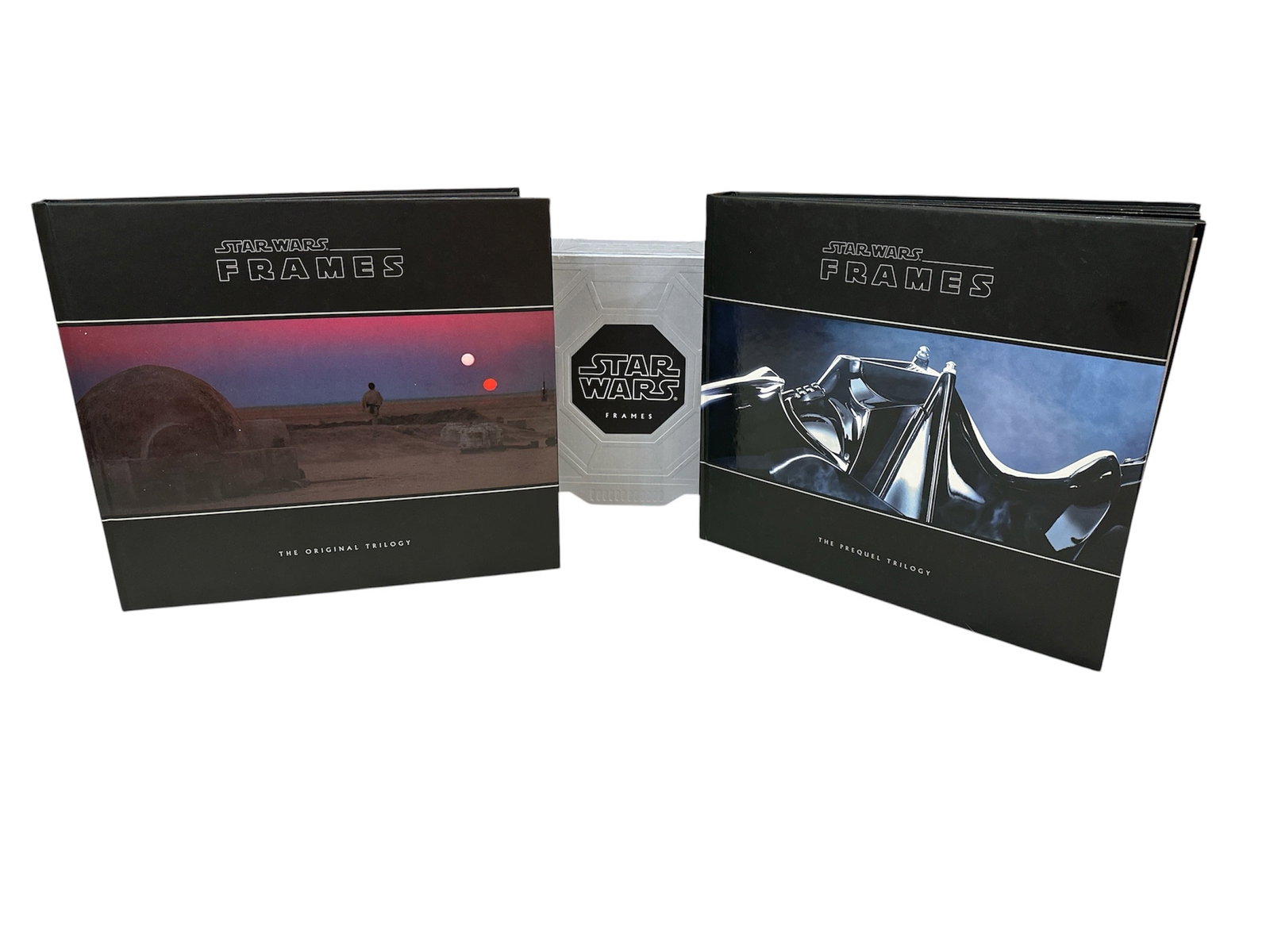2013 Collector's Edition STAR WARS: FRAMES: Boxed set featuring two hardcover volumes celebrating the Star Wars saga. Includes a foreword by Guillermo del Toro, with photographs personally selected by George Lucas, showcasing iconic moments,