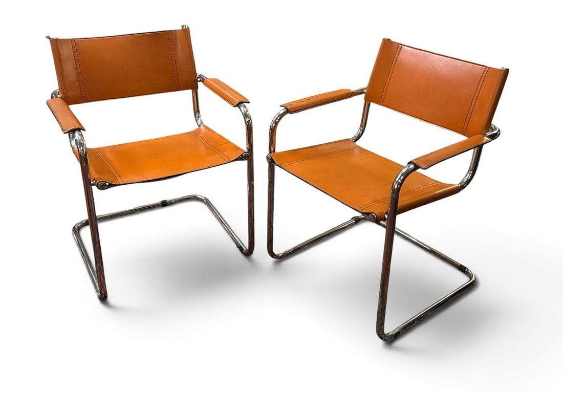 Mid Century Italian Modern Cantilever Chairs Pair HERMES Orange Leather in the style of MART STAM: Chrome frames with leather seat, back, and arms. Measures 30.25" H to back x 18" H to seat x 23.75" W across arms x 21" D