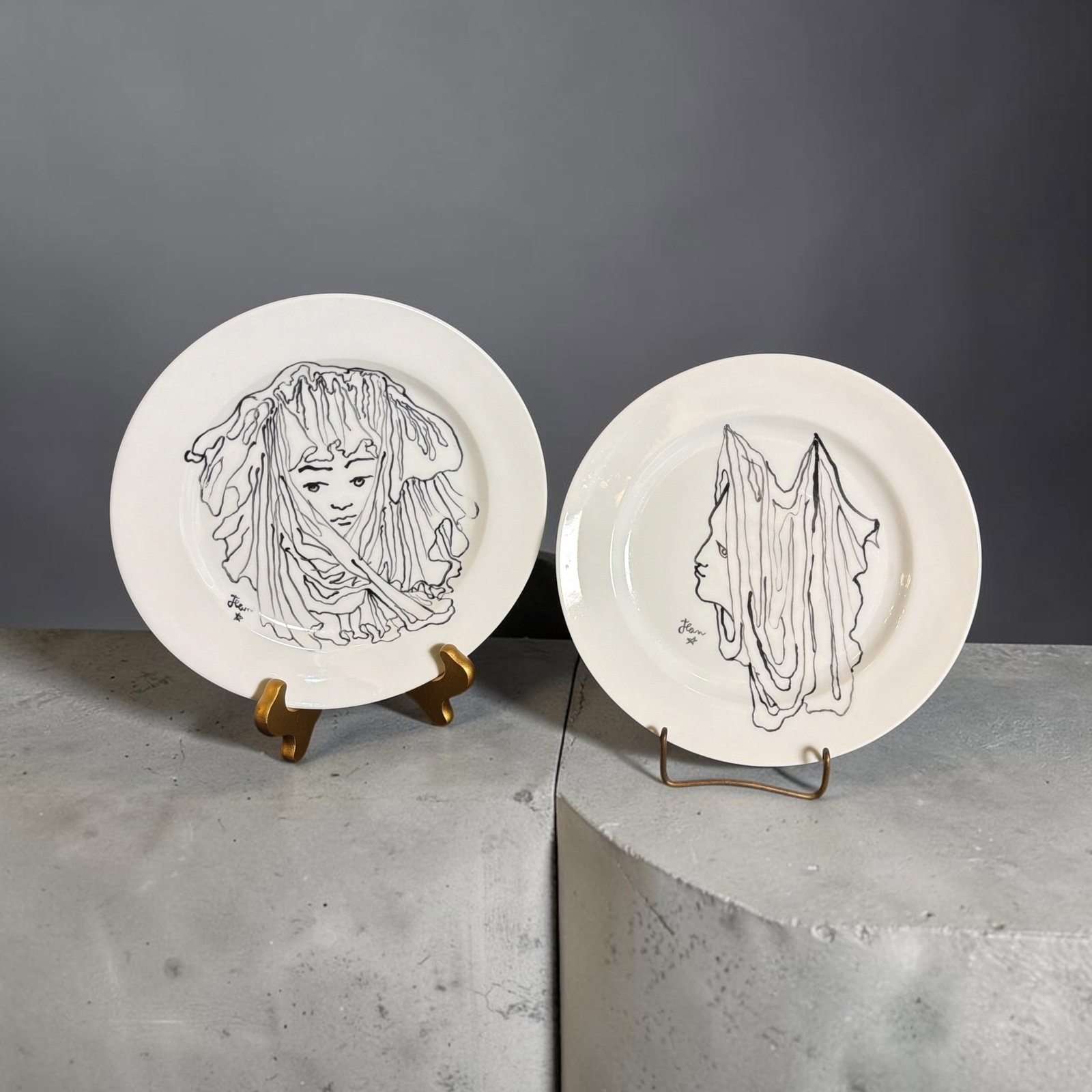 Two JEAN COCTEAU For CRISTOFLE Design Plates: Both measure 1" H x 9.5" diameter.