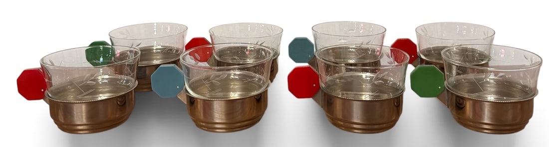 Rare Modernist Art Deco Chrome Bakelite Barware: Each holder measures 2.5" H x 4.5" w including handle x 3" diameter. Clear etched glass measures 2.5" H x 3.25" diameter. The red-handled cups appear to be Bakelite, the blue and green are not.