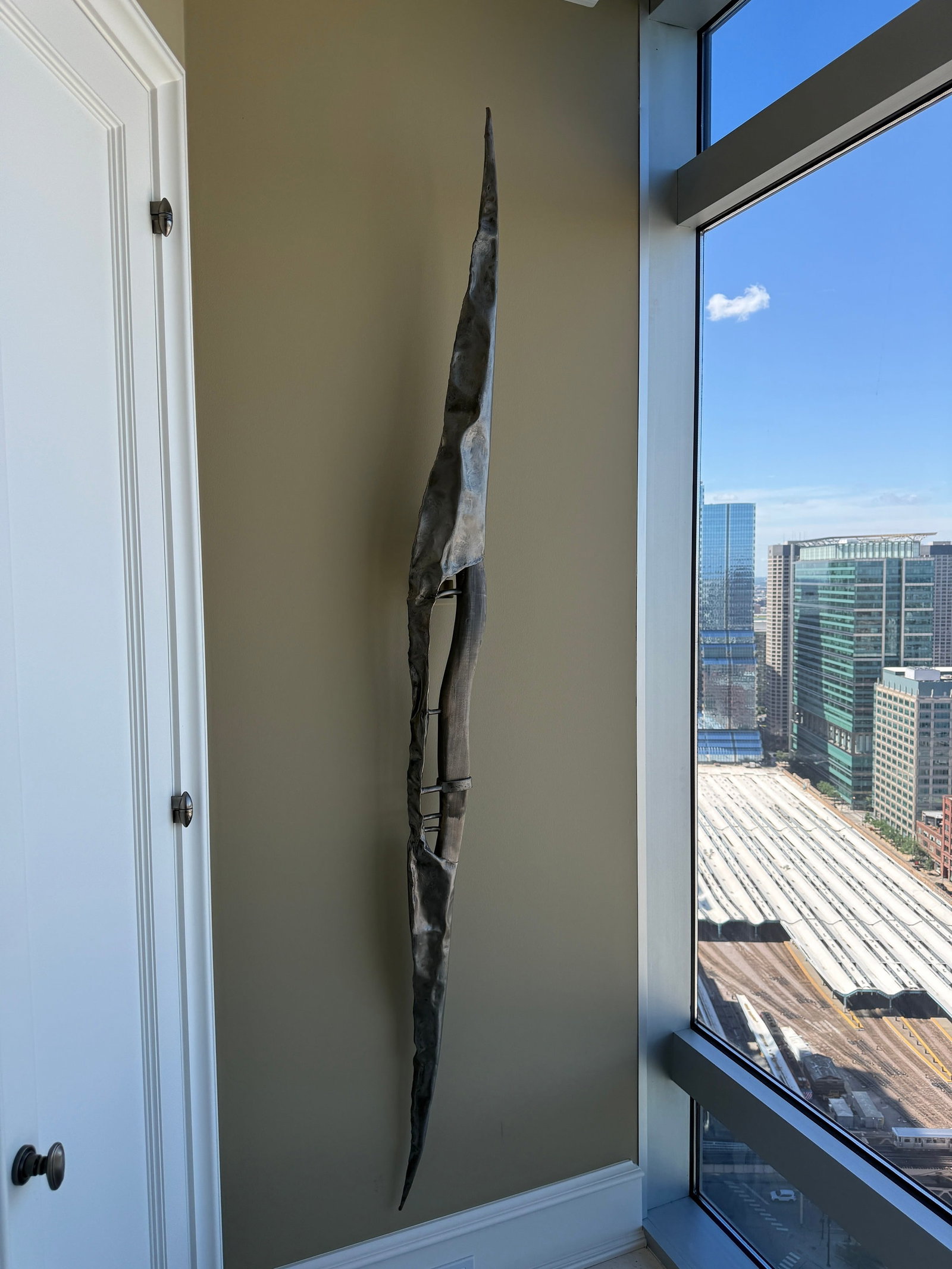 French Modernist Steel Wall Sculpture: 90" H x 6.25" W x 5" D. Comprised of welded steel and wood.