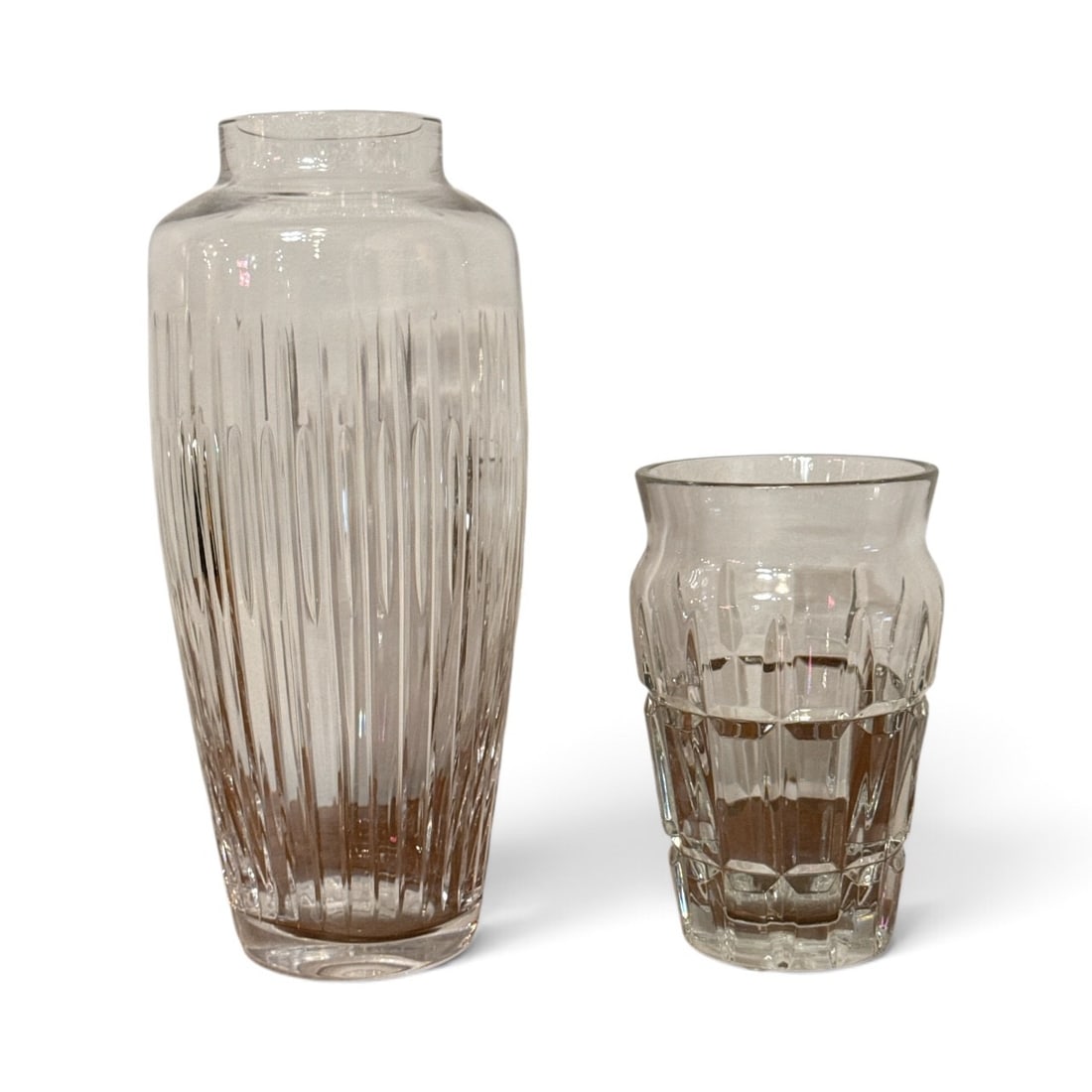 Modernist BACCARAT and ATLANTIS Crystal Vases: Includes an Atlantis Sonnet vase that measures 12" H x 5" overall diameter and a Baccarat "Nadine" vase that measures 7" H x 4" overall diameter.