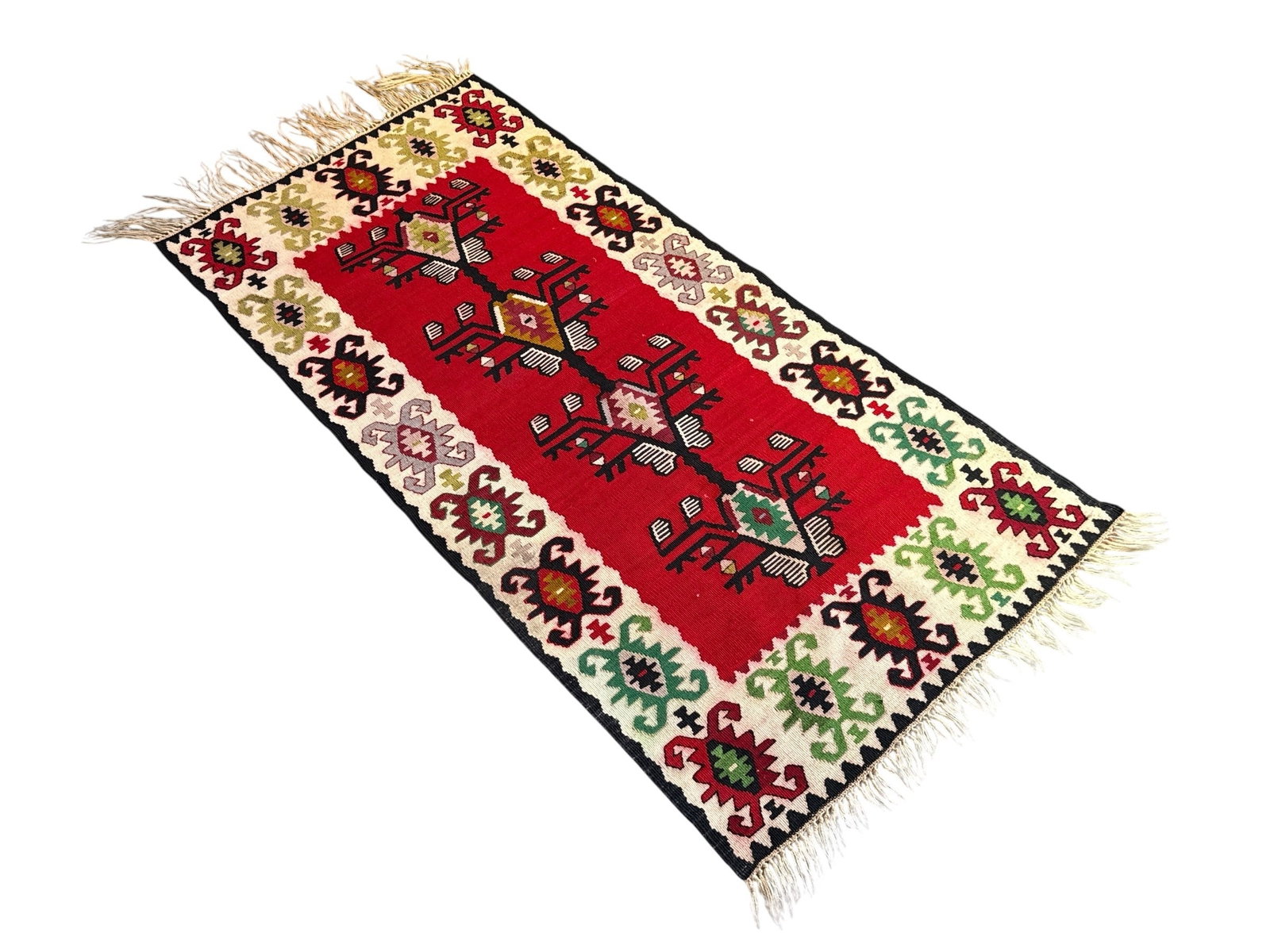 A Turkish Kilim Rug: 64" x 27".