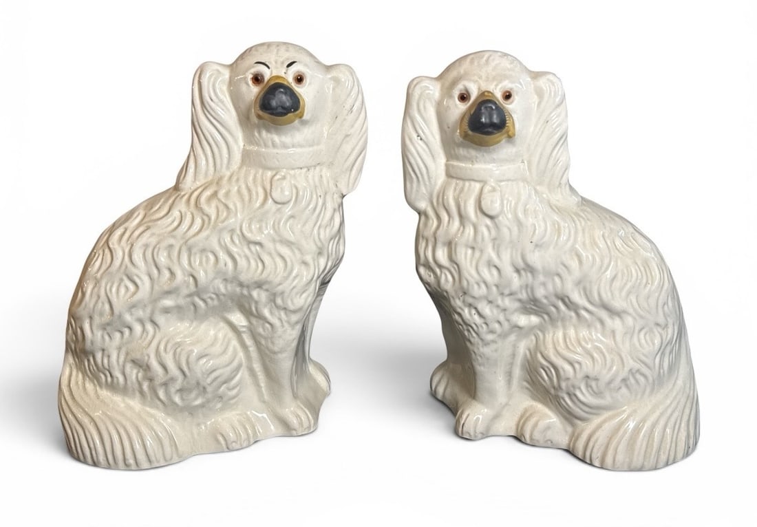 Antique English Staffordshire Dogs Pair: Porcelain, with glass eyes and painted snout. Circa mid to late 19C. 12.5" H x 8.5" W x 5" D