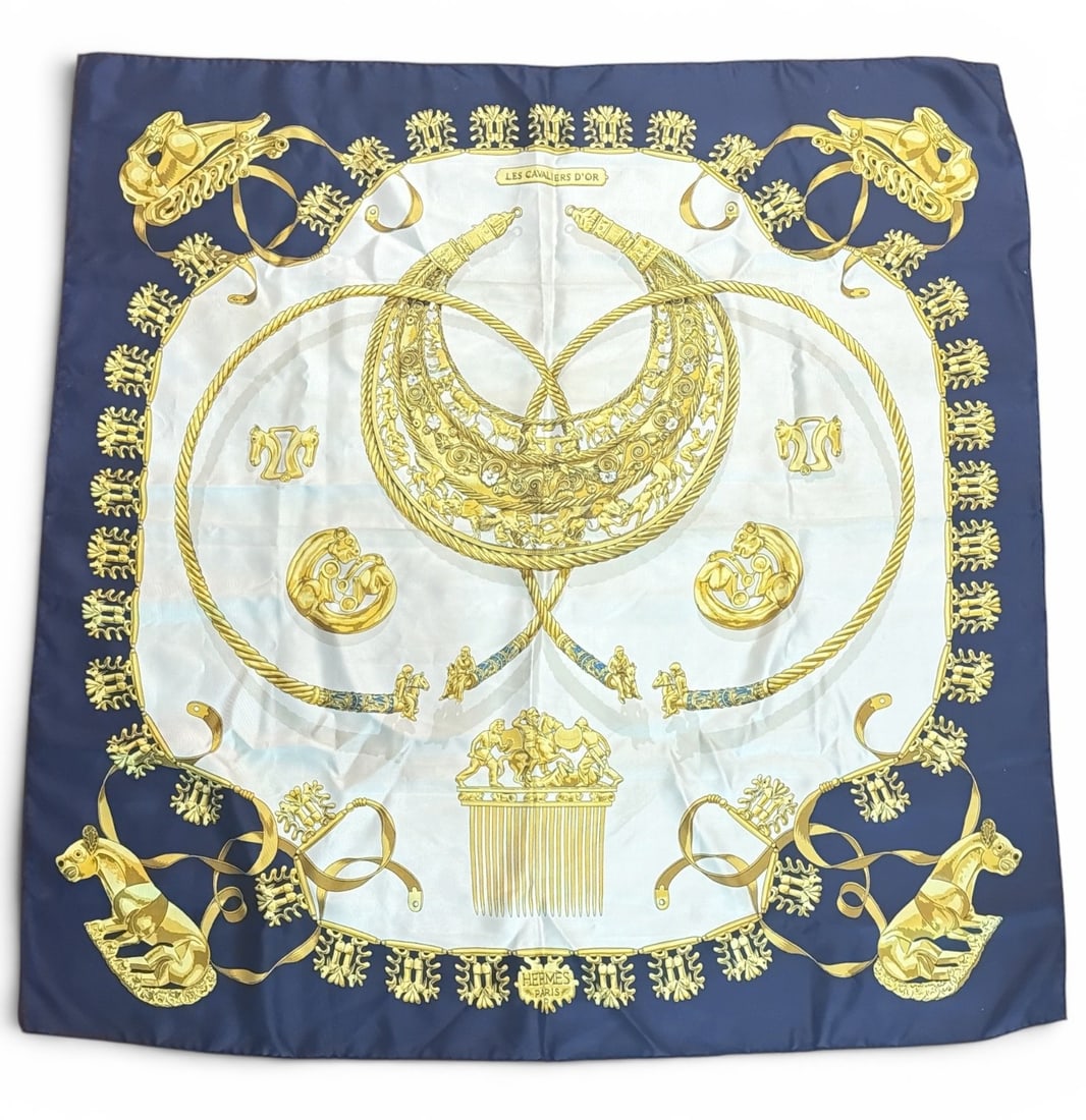An HERMES Les Cavaliers d'Or Carre 90 Silk Scarf: Measures approx. 35" x 35". Retains a Made in France Neiman Marcus tag.