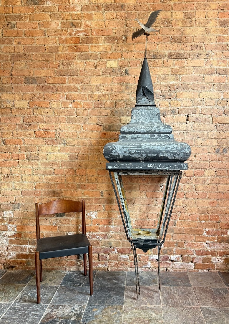 Substantial Early 20th C Street Lantern Light: Measures approx. 96" H x 26.5" x 26.5" at the widest part of the lantern. Hand Wrought iron base. Galvanized metal top lantern and bird weathervane. Originally a gas lantern and converted to be electr