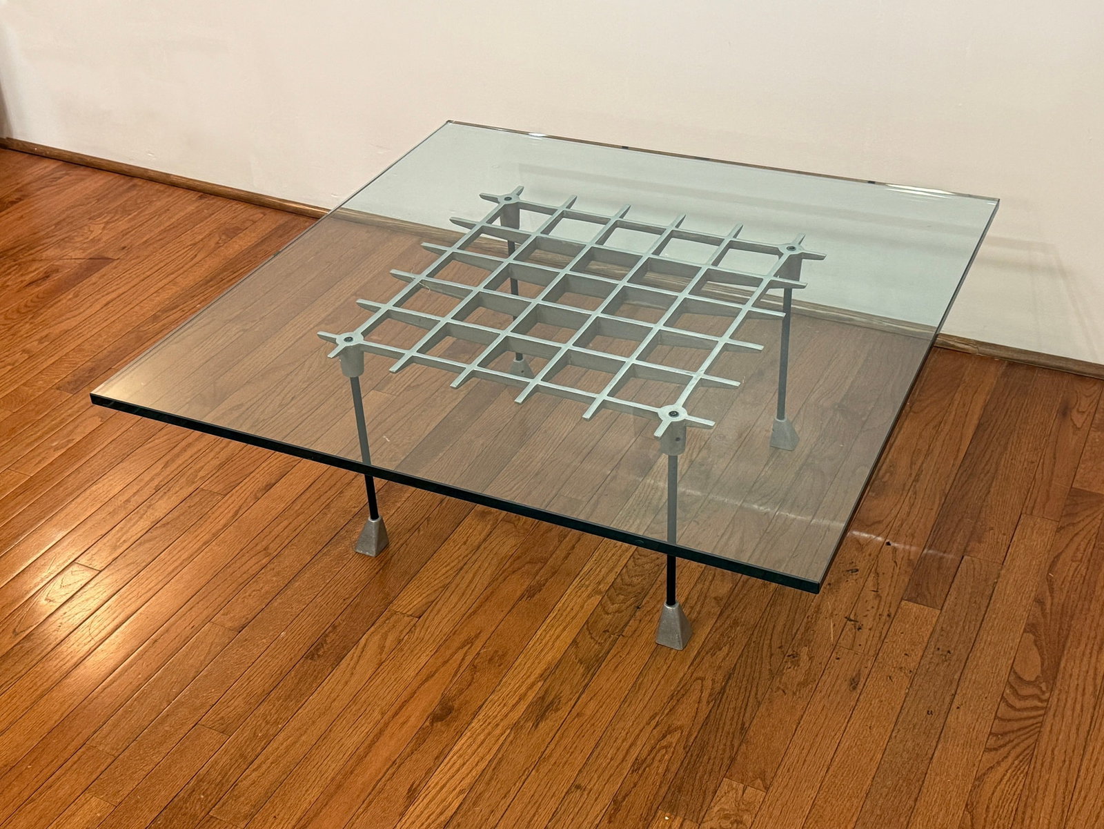 ROBERT JOSTEN "Grid" Coffee Table: Aluminum base. Measures 15.5" H x 40" W x 40" glass top. Glass is 0.75" thick.