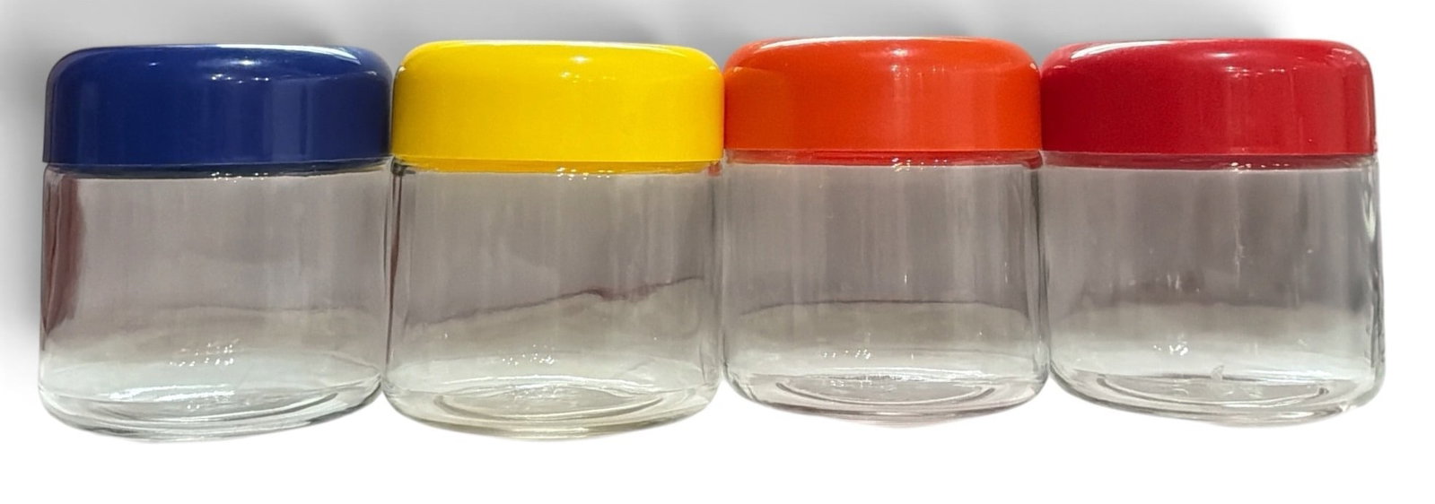 Set of Four MASSIMO VIGNELLI For HELLER Mod Glass Cannisters: Includes four glass storage cannisters by Massimo Vignelli for Heller. Each measures 6" H x 5" diameter.
