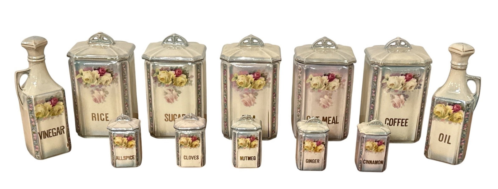 1920's Czechoslovakian Porcelain Lusterware Kitchen Canister and Spice Jars: Includes pantry jars, spice jars, and oil/vinegar cruets. Cannisters measure approx. 8" H x 4.5" W x 4"D.