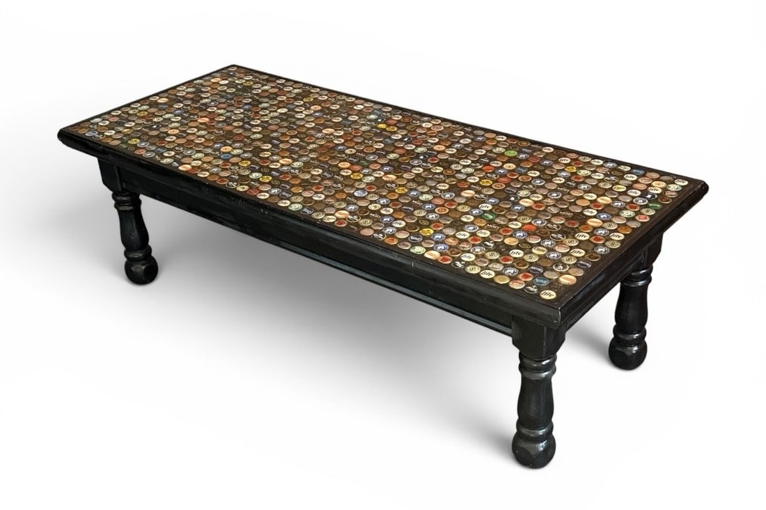 POPS CASEY (American, 20th C.) Folk Art Beer Bottle Cap Coffee Table: Measures 16.5" H x 51" W x 21" D.