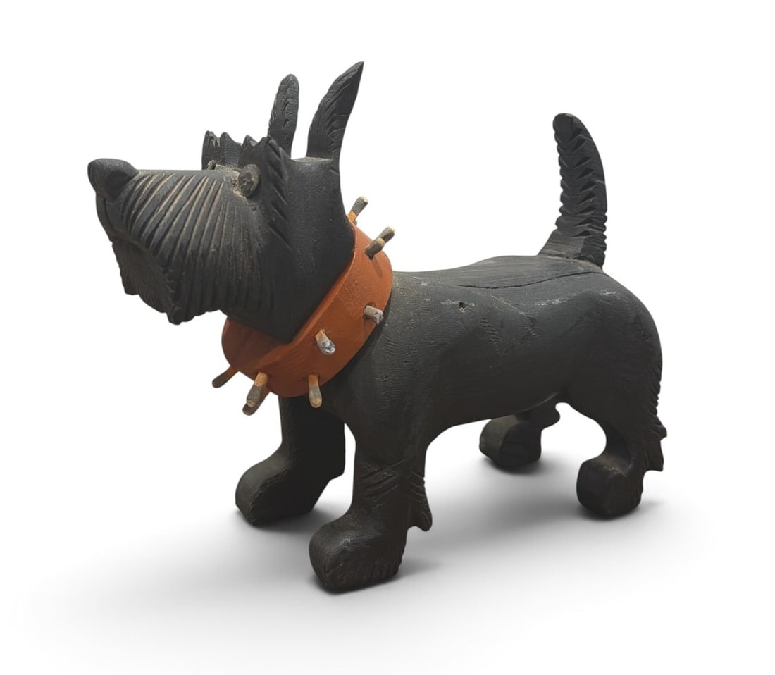 Folk Art Early 20th C Figural Dog Cigarette & Match Holder: Measures 6.5" H x 3" W x 8.5" D. His spiked collar holds matches, his back opens to hold cigarettes, and his butt is a strike pad.