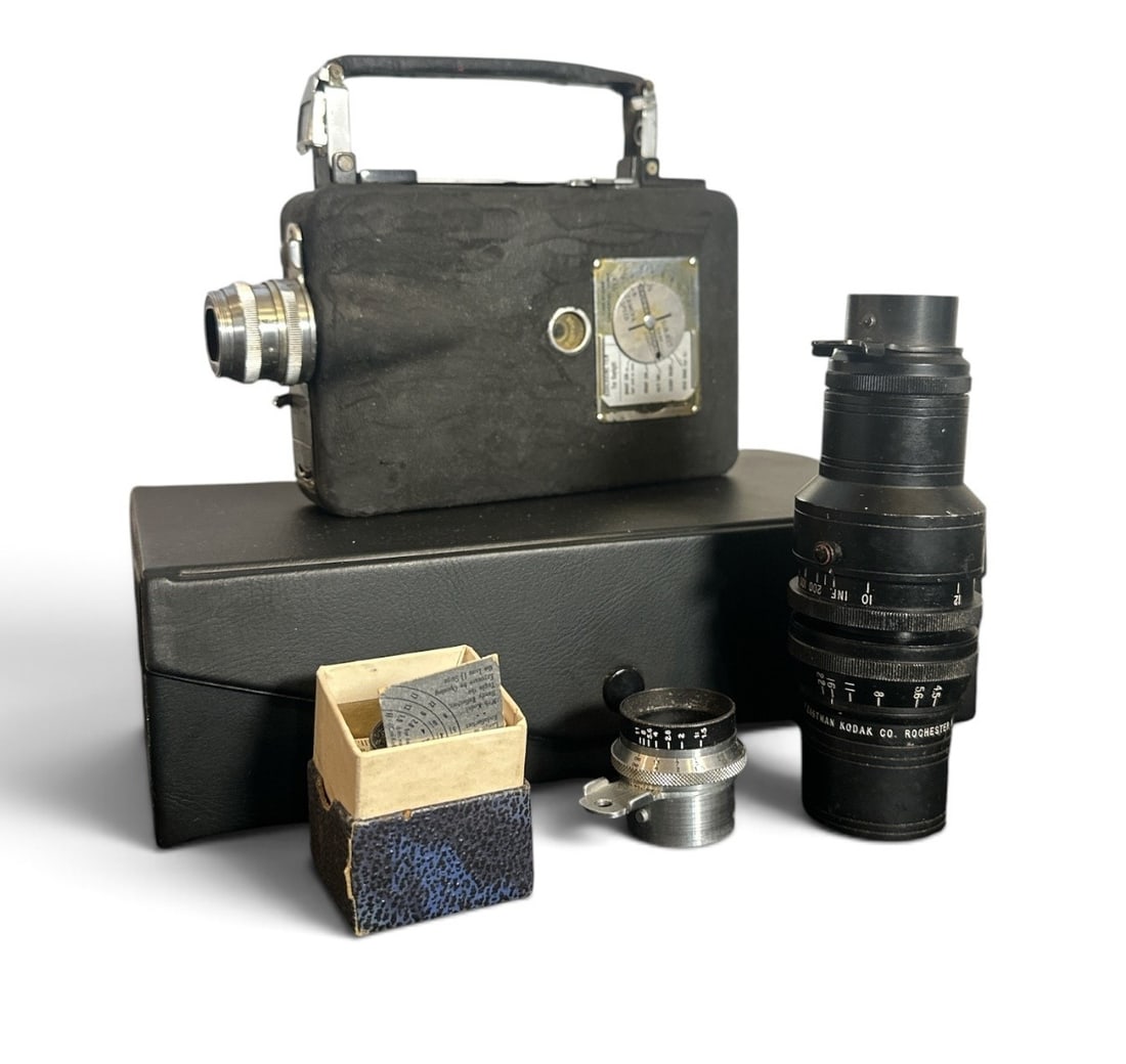 CINE-KODAK Magazine 16mm Hand Held Camera: Circa 1930s / 1940s. Comes with extra lenses. Carry case measures 3" H x 10" W x 6.5" D.