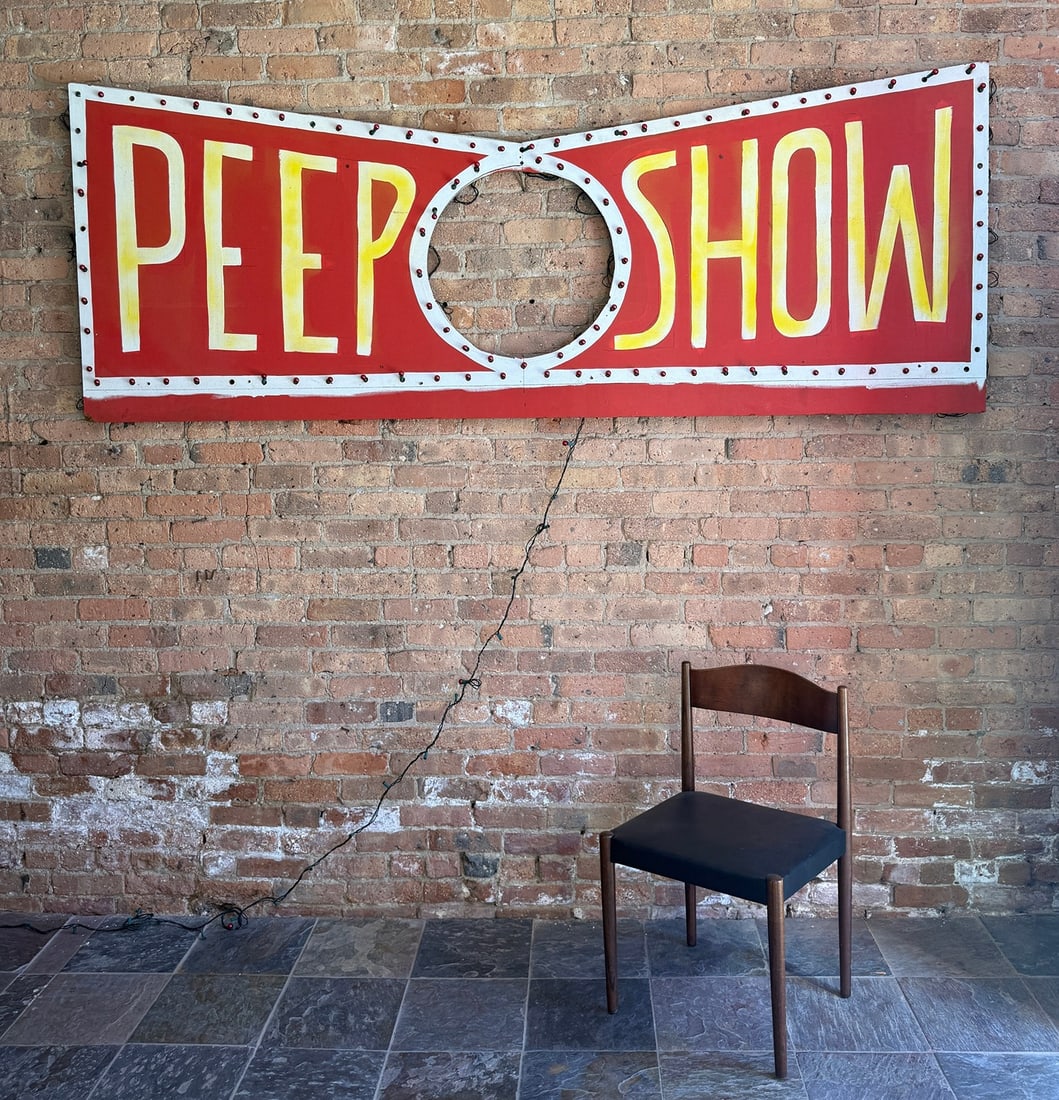 PEEP SHOW, 8 Foot Vintage Carnival Sign: Painted plywood. Measures 36" H x 96" W x .25" thick. Consignor states from Medusa's in Chicago or the owner of Medusa's.