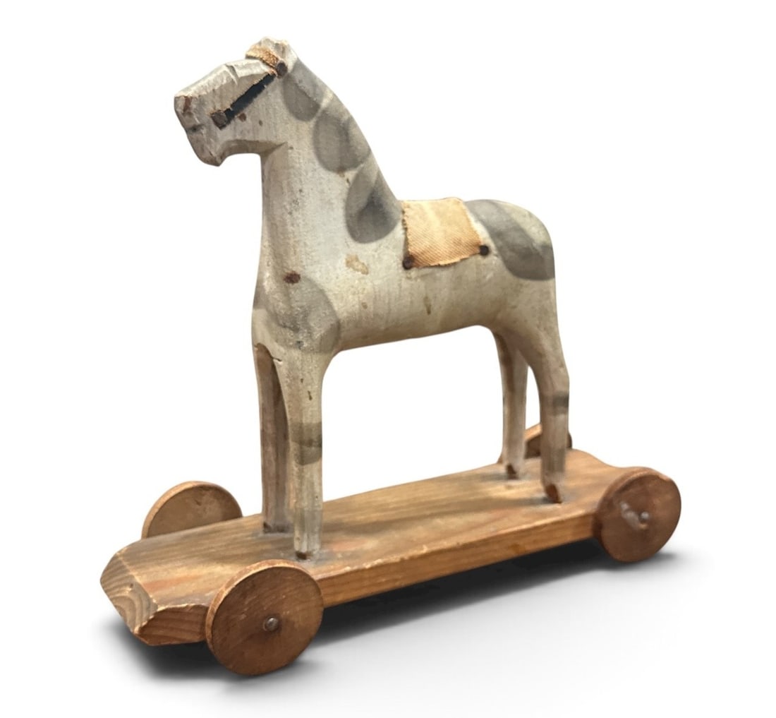 Petite Scandinavian Carved Horse Pull Toy, 1920: Measures 6.5" H x 2.5" W x 8" D. Signed Serige Sven Sorensen and dated 1920 on the bottom.