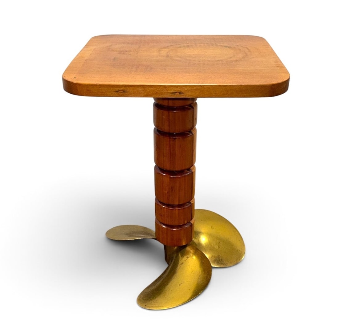 Nautical Folk Art Propeller Table: Cedar wood with metal propeller. Measures 19" H x 14" W x 14" D.