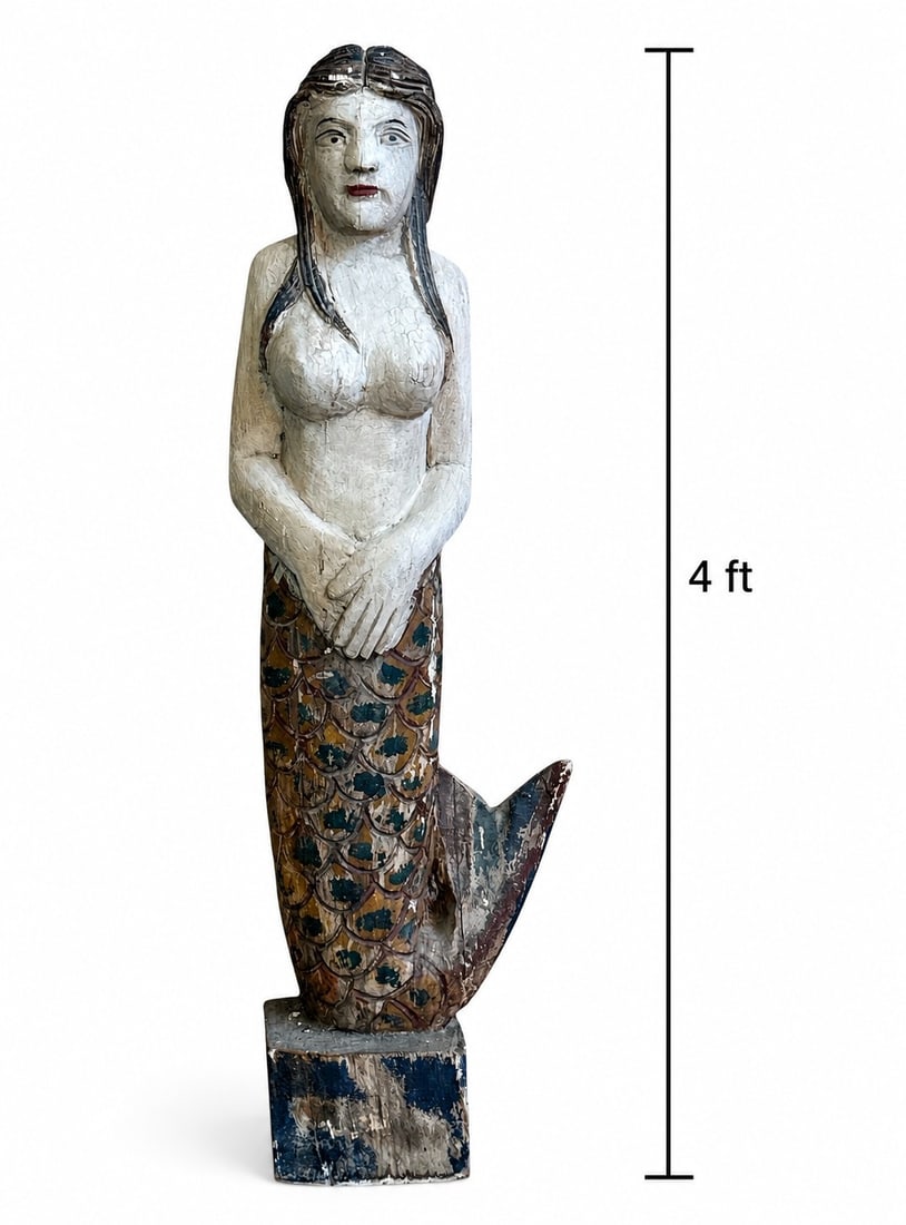 A 4 Foot Hand Carved Sea Maiden: Wood. Measures 48" H x 9" W x 7" D.