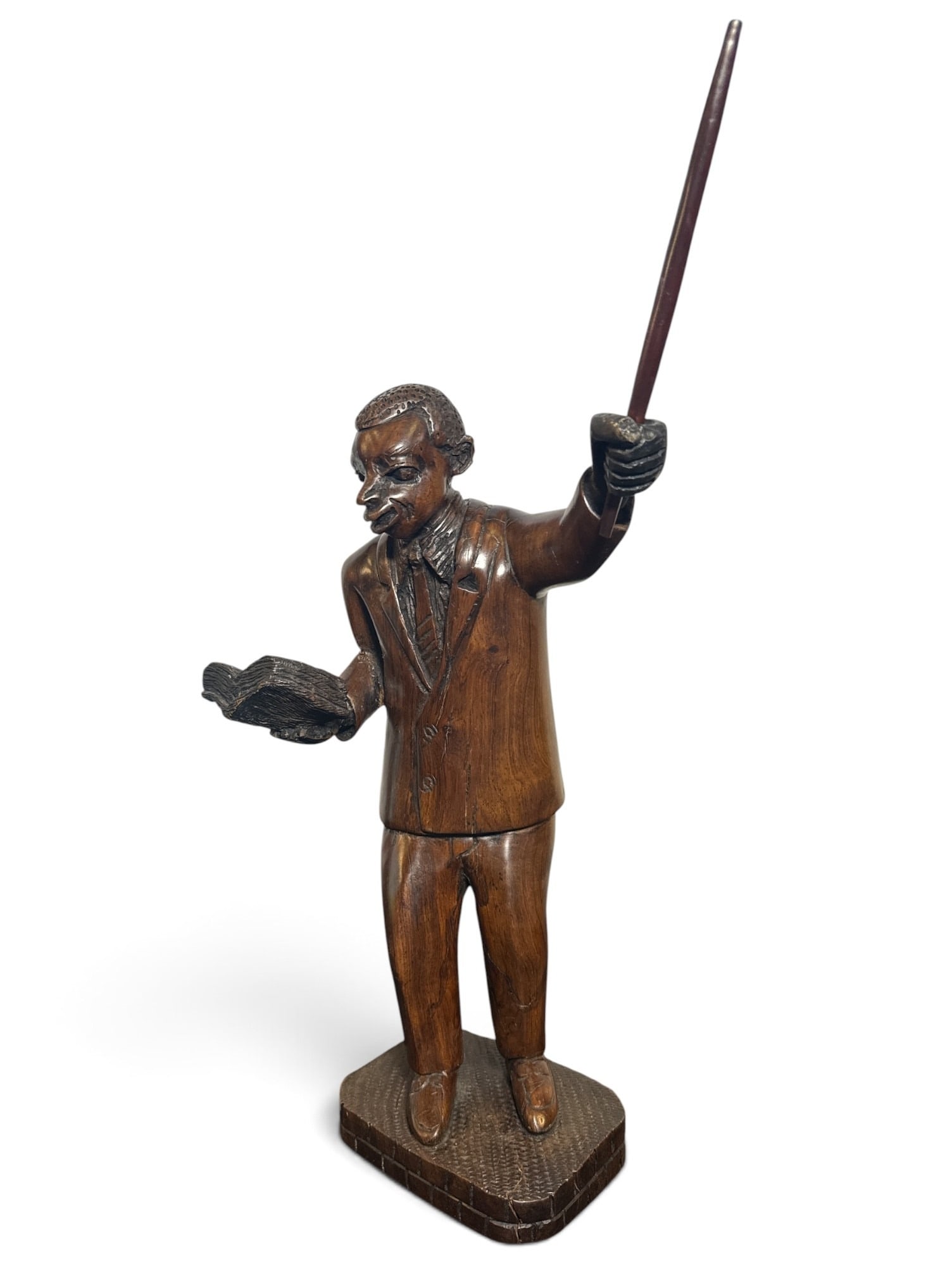 Black Americana Carved Wood Pastor Sculpture: Depicting a pastor reading from the bible and raising a staff. Measures 19.25" H x 10" W x 6.5" D.