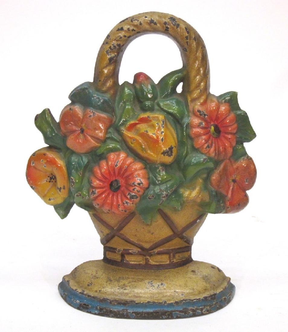BASKET OF FLOWERS DOORSTOP: Painted cast iron "LACS" stamped on back; overall minor chipping of painted surface, mainly on high spots; H-10 1/2", G-VG