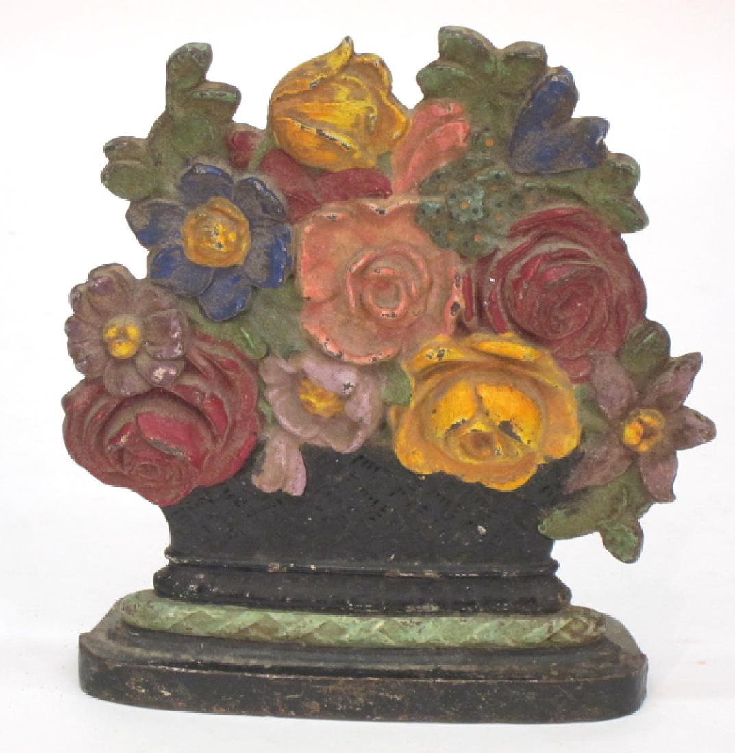 BASKET OF FLOWERS DOORSTOP WEDGE: Painted cast iron; minimal paint loss; H-7 1/2", VG-EX