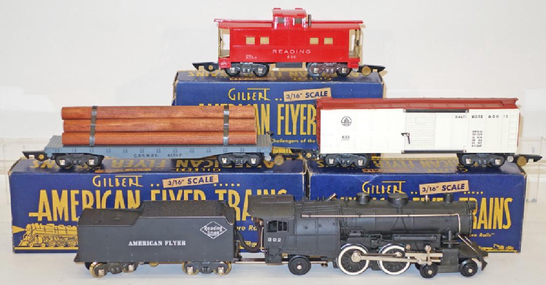 AMERICAN FLYER TRAIN SET 4801A "Reading Lines": 302 Engine, tender, 633 box car, 4259-7 metal flat bed, 630 caboose; original shipping box with yellow, red and grey label; blue and yellow interior boxes, original packaging; instruction manual, insp