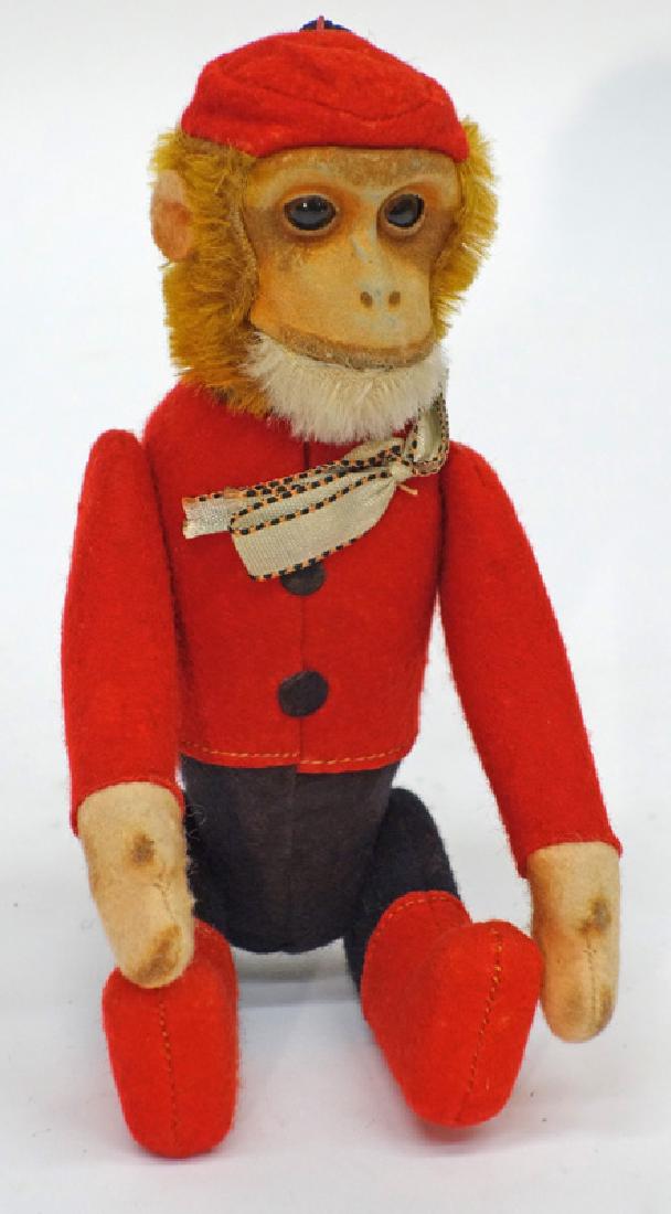 MONKEY FLASK: Cloth dressed; glass eyes; jointed monkey; head lifts to expose flask; normal wear; H-8", G-VG