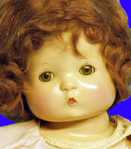 EFFANBEE PATSY WIGGED COMPOSITION DOLL: marks: (head) EFFANBEE//PATSY; (torso) EFFANBEE//PATSY//DOLL; 6 piece composition body;glassene eyes (clear);Effanbee heart necklace;original mohair wig (mussed) Redressed; undies marked:NIKO//FIFS Pa