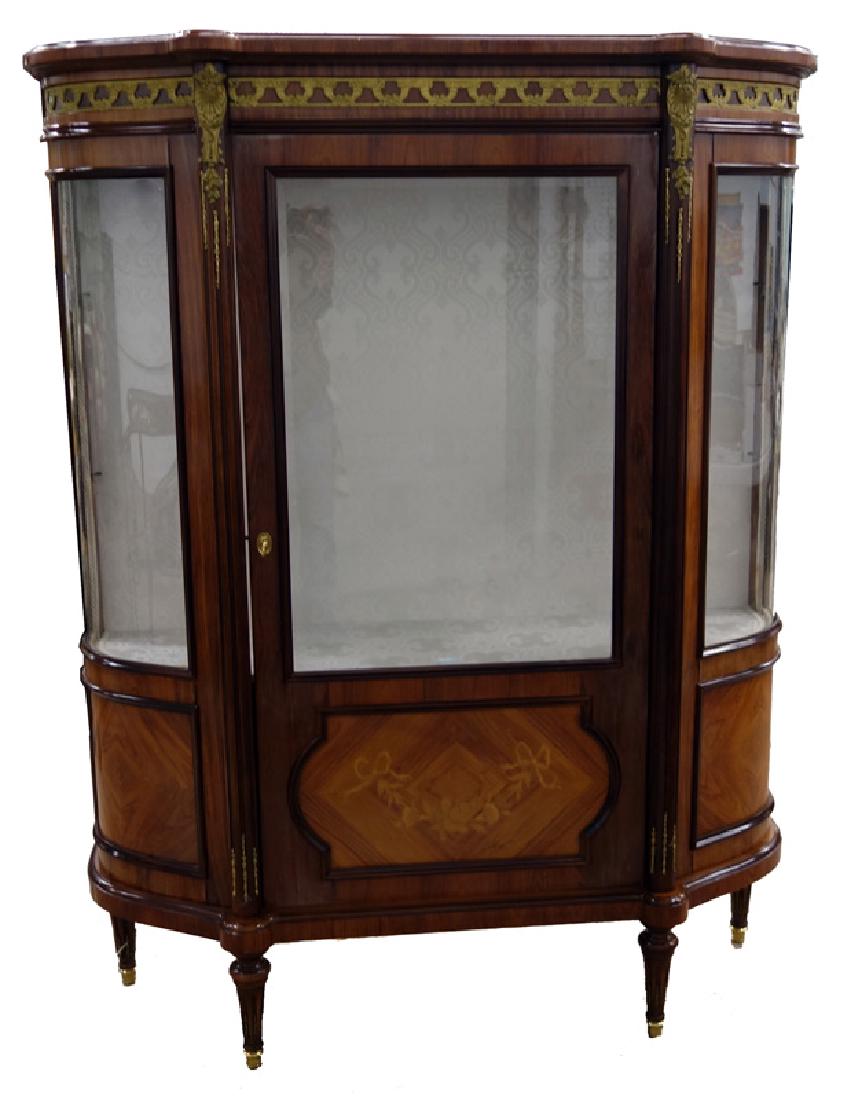 PROVINCIAL STYLE CHINA CABINET: Walnut (?) with bronze ormolu, beveled glass door, cloth backing; minor veneer loss and damage; H-66", W-50", G-VG