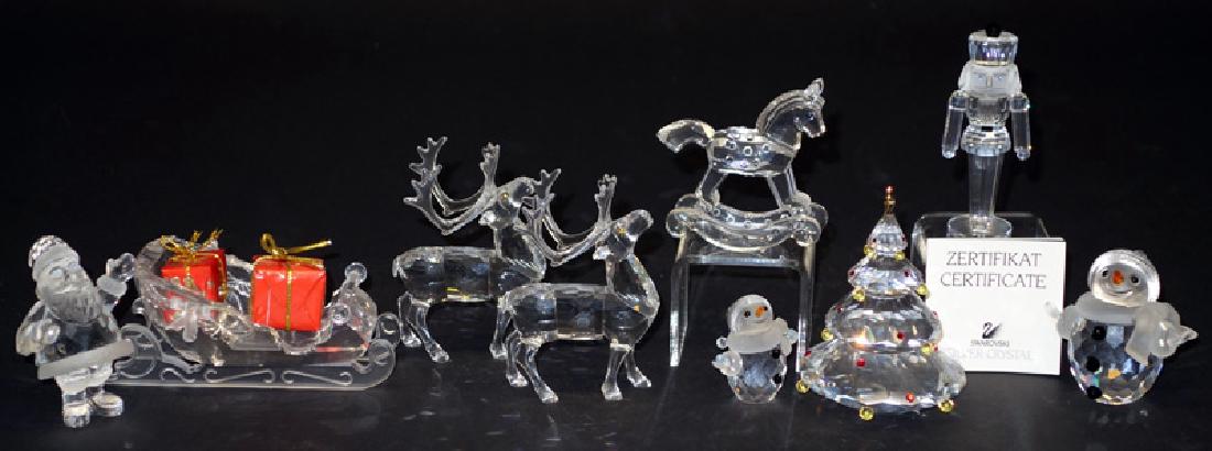 SWAROVSKI CHRISTMAS CRYSTAL FIGURINES (10): Santa, Sleigh, (2) Reindeer, (2) Christmas Trees; nutcracker, little snowman, large snowman, rocking horse, Santa has original box, other pieces come in original grey cylinder containers; Sleigh L-4 1