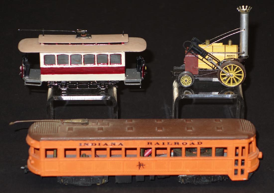 TROLLEYS, ETC. (3): HO & N Gauge; (1) Triang "Rocket"; (1) Indiana Railroad Trolley; (1) Japanese Trolley (overpaint); L-2 1/4" - 6 1/2", G-VG