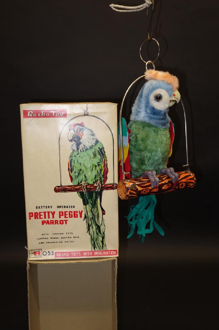 "PRETTY PEGGY PARROT" BATTERY OP: Rosko Japan; litho tin and plush; not working; original box is VG-EX; H-13", NM