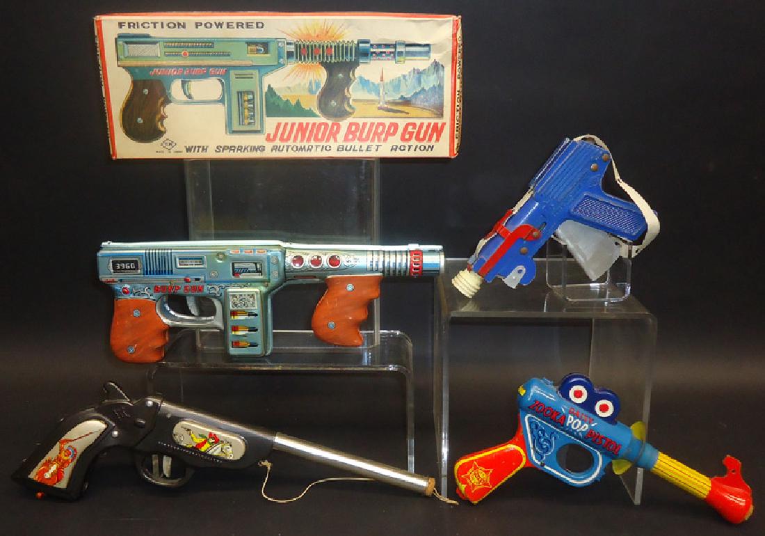 TOY GUNS (4): Litho tin and metal; (1) Junior Burp Gun: friction; TN Japan, original box; (1) Zooka "Pop" pistol, Daisey; (1) Pop pistol - K Japan; (1) Supernumatic Junior cap gun; normal wear; longest L-12", VG-EX