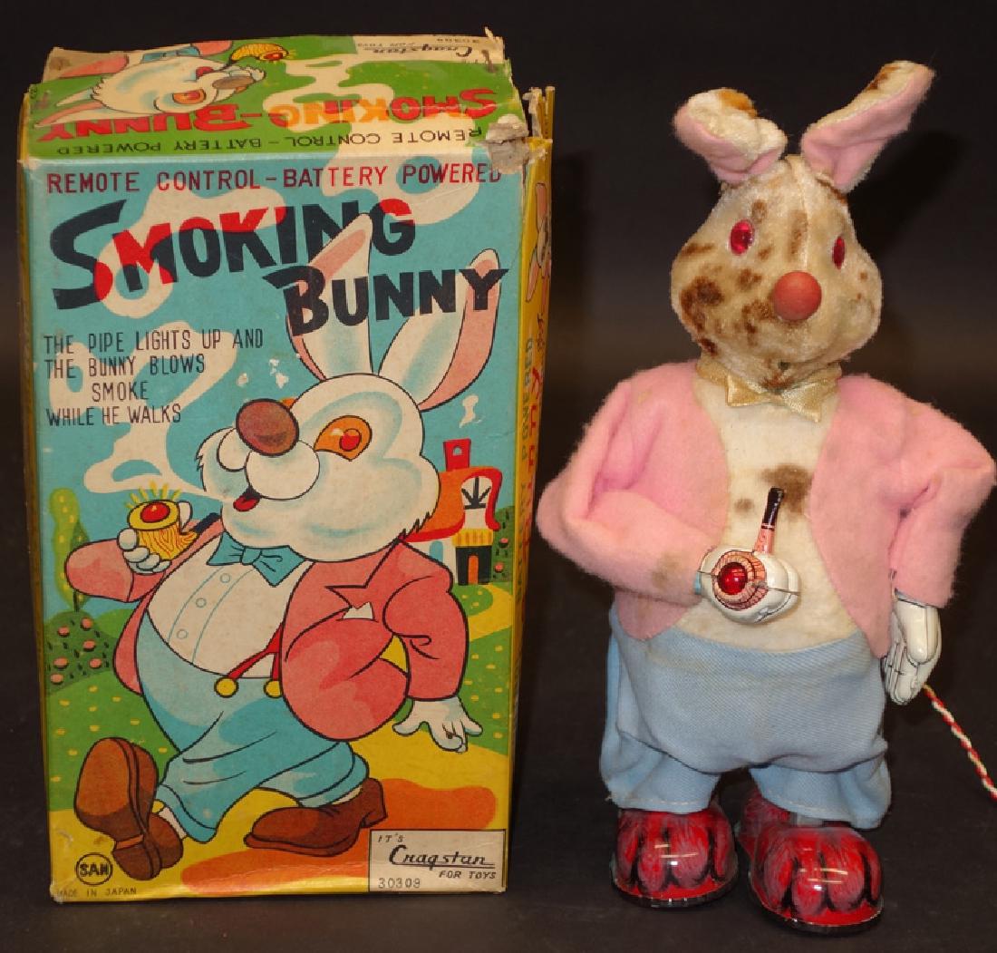 SMOKING BUNNY BATTERY OP: San Japan; plush, cloth and tin; battery op not working; original box worn; some soiling; normal wear; H-9", G-VG