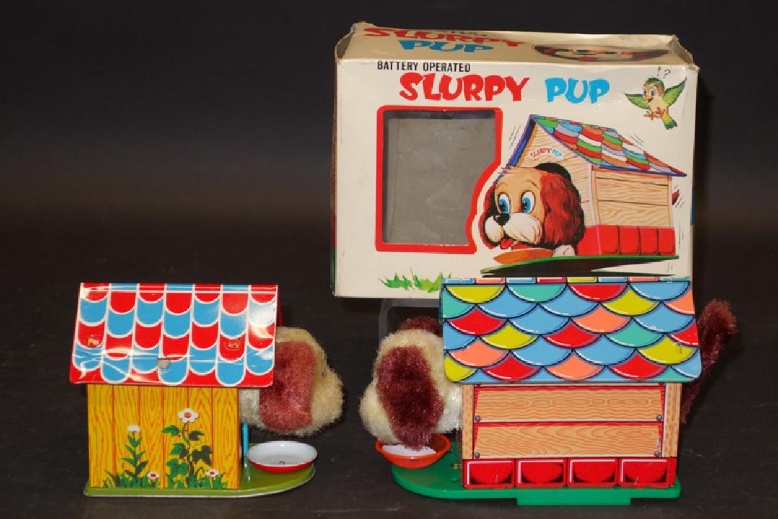 JAPANESE DOG TOYS (2): litho tin and plush; (1) Slurpy Pup: battery op, untested, original box is G-VG; (1) dog: mechanical; working; normal wear; L-4"-6", G-VG