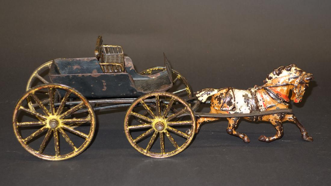PRATT & LETCHWORTH SURREY: Painted cast iron; mostly original paint; over-coated; paint loss; front wheel missing; seat loose; no figure; L-15", F