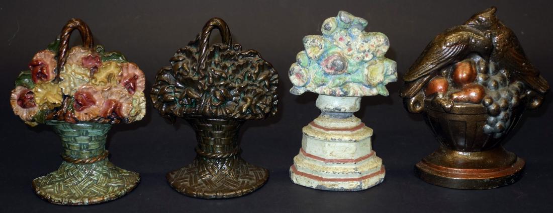 BASKETS OF FLOWERS AND FRUIT DOORSTOPS - (4): Painted cast iron, (2) Repainted; H-6"7"; F-G