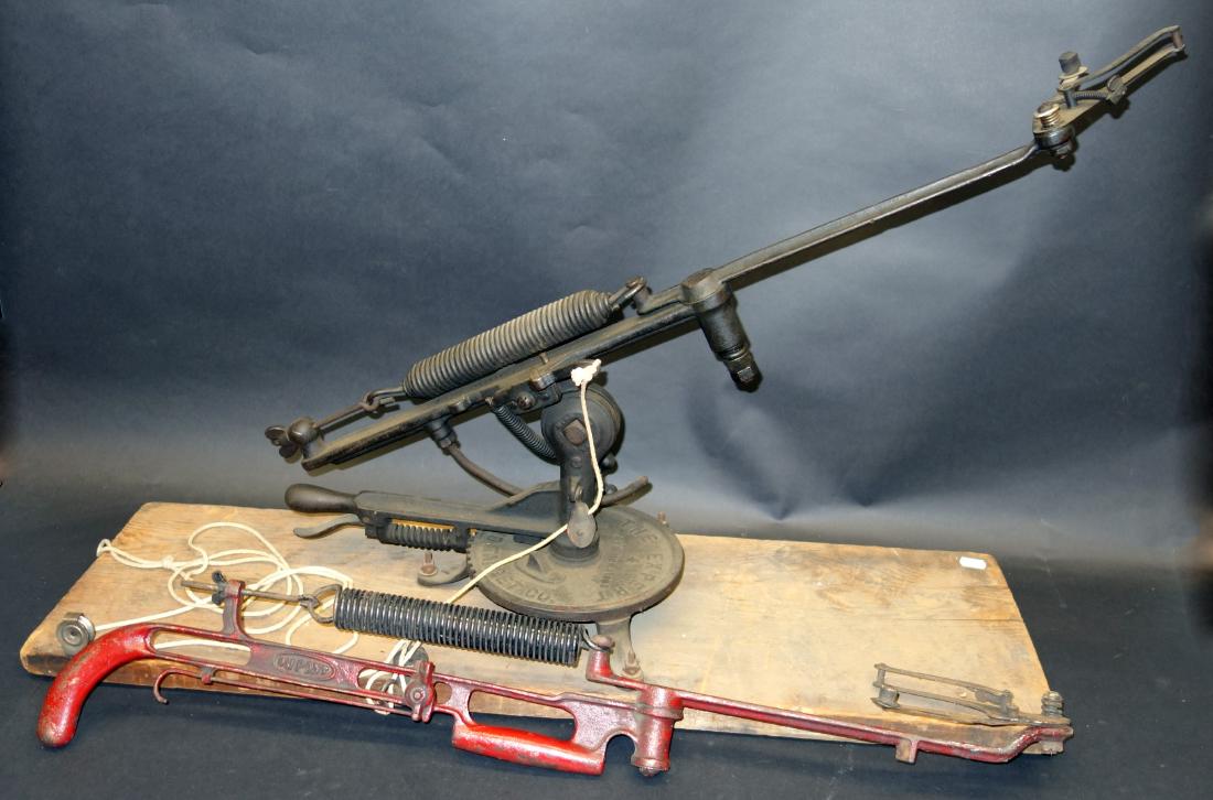 CLAY PIGEON THROWERS (2): Cast iron; (1) Dupont gun form; (1) "The Express" Cleveland Target Co., mounted; normal wear; L-36", G