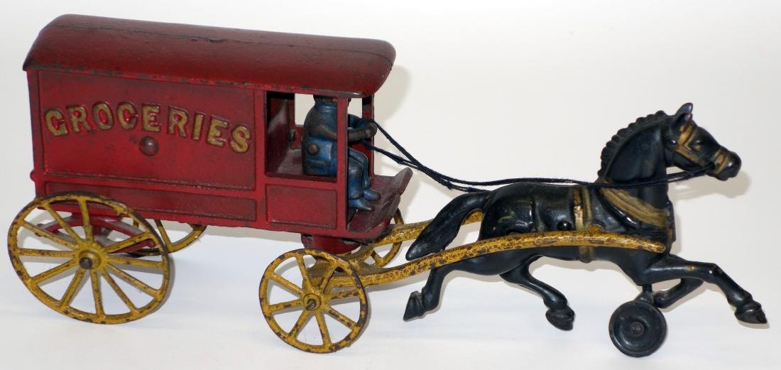 CAST IRON "GROCERY" WAGON (1 of 1)