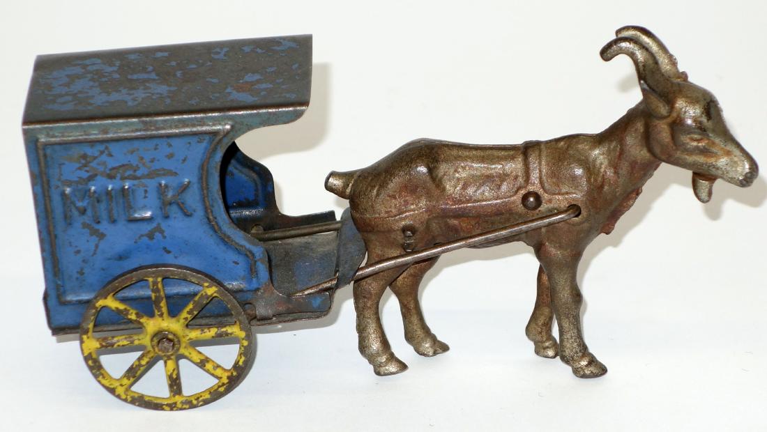 GOAT DRAWN MILK CART: Plated cast iron and painted tin; wear; L-7", F-G