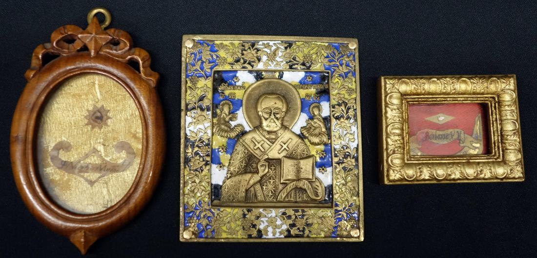 (3) RELIGIOUS PIECES: Includes: (1) Russian bronze and enamel plaque, St. Nicholas; (1) reliquary of St. Nicholas, threads and wax seal intact; (1) reliquary of St. Barbara, thread and wax seals intact; normal wear; larges