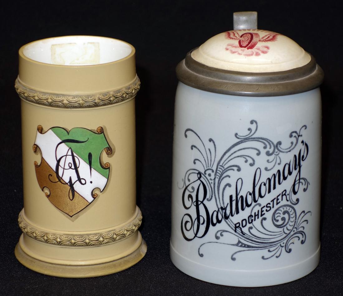 METTLACH STEINS (2): Ceramic, green marks; (1) Bartholomay Brewing with winged wheel lid #1909; (1) coat of arms, missing lid, #281; normal wear; H-5"-5 1/2", G