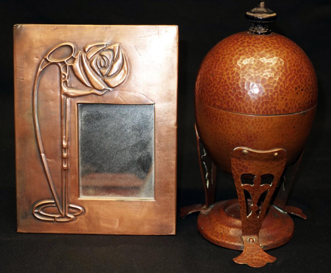 COPPER EGG CODDLER & MIRROR (2) PCS.: (1) Coddler-hammered copper with silver liner, Joseph Heinrich, no burner; (4) interior cups; (1) dresser mirror-embossed Art Nouveau flower; H-10", G-VG