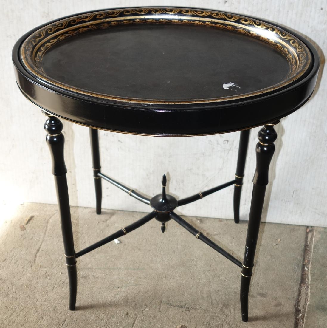 TOLE TRAY TABLE: Painted metal oval tray with gilt trim on turned wood leg stand; normal wear; H-21", L-21", G-VG