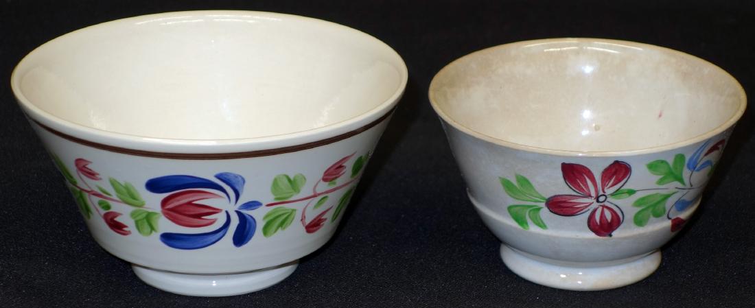 COUNTRY ITEMS (3): (2) soft paste bowls, floral decoration, some staining on smaller bowl, Dia.-4"-5"; (1) yellow ware rolling pin, normal wear and crazing; L-15", G-VG