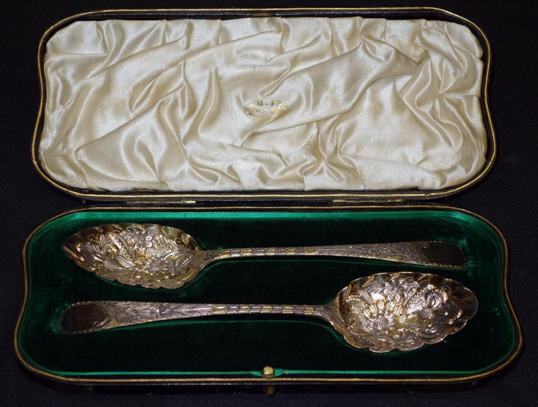 PAIR OF ENGLISH STERLING BERRY SPOONS: Cased; Robert Rogers and John Lautier; re-worked and gold dipped, circa, 1890, 3.4 TO; L-8 3/4", VG-EX