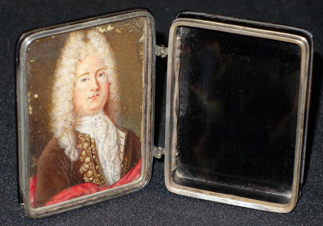 TORTOISE SNUFF BOX: Raised panel top and bottom; interior decorated with painting on porcelain of gentleman; chipped corners; some case damage; portrait some flaking; H-3 1/4", G
