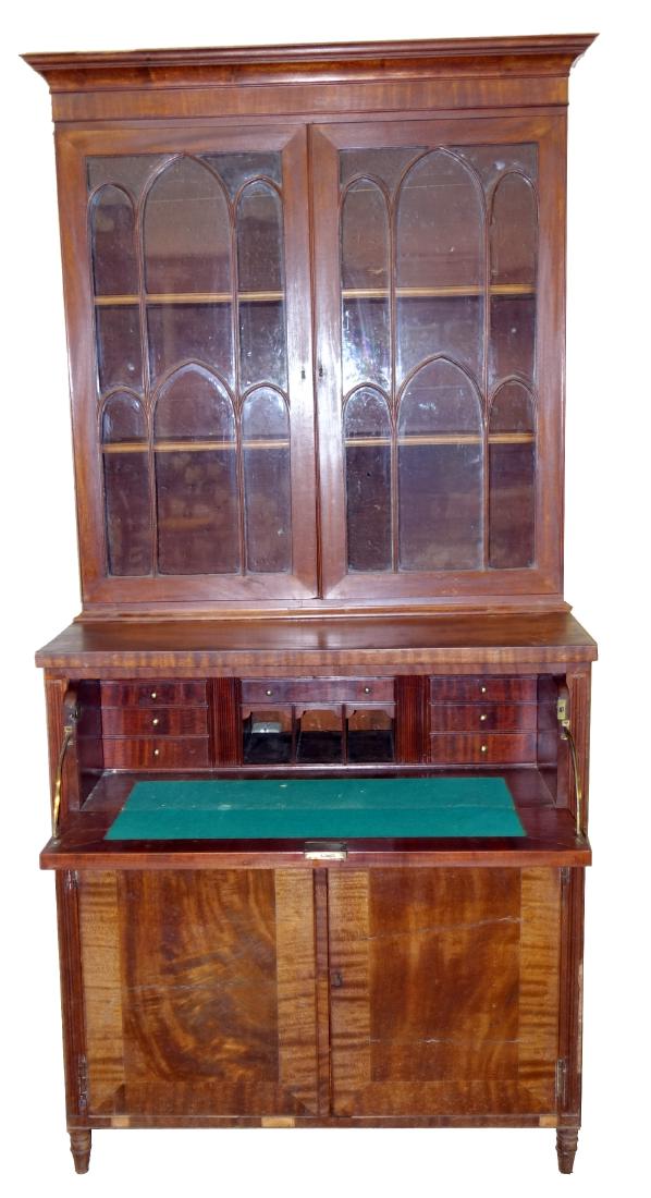 COUNTRY SHERATON SECRETARY: Mahogany, double arch mullion door top; butlers desk drawer over two doors; bottom section has linen drawers; veneer and finish damage; H-82", W-41", P-F