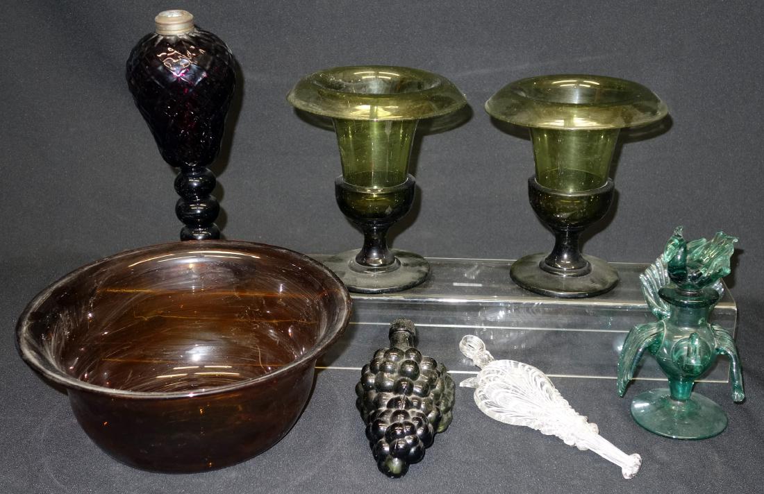 ANTIQUE COLORED GLASS (7) PCS.: Includes: Nailsea bellows flask, figural olive green grape flask, amethyst lamp, figural turkey with bird stopper, amber bowl, (2) green vases; lamp H-10", G-VG