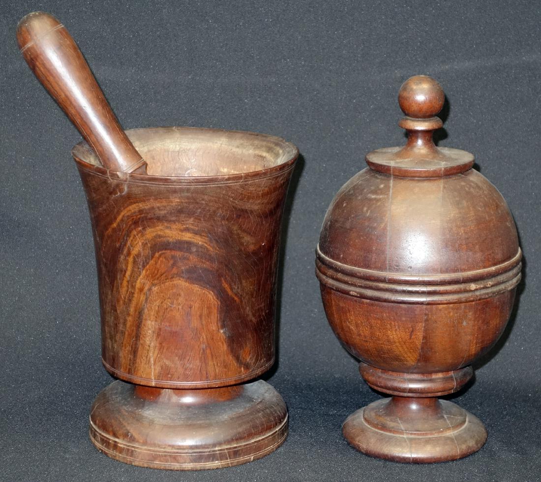 TREEN WARE (2) PCS.: (1) mortar and pestal, possibly rosewood; some chips; (1) ball form box - mahogany, m inor inner rim chip; H-8"-10", F-G