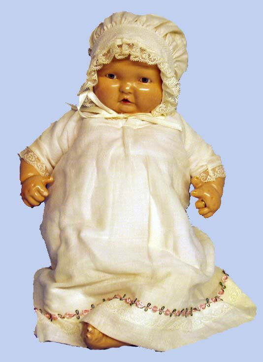 EFFANBEE LAMBKINS COMPOSITION DOLL: EFFANBEE LAMBKINS - "(circle) c Lambkins"; composition head on original cloth body with composition limbs; sleep eyes; redressed; composition in very good condition; slight rubs. H-15", VG
