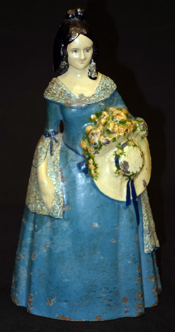 LADY WITH BONNET DOORSTOP: Painted cast iron, original paint; some chipping and wear; H-12", G-G+